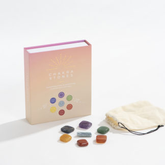 Chakra stones box: peach box with 7 crystals of different colors lying in front