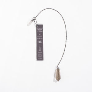Smoky quartz pendulum with gray tag "grounded dreams pendulum"